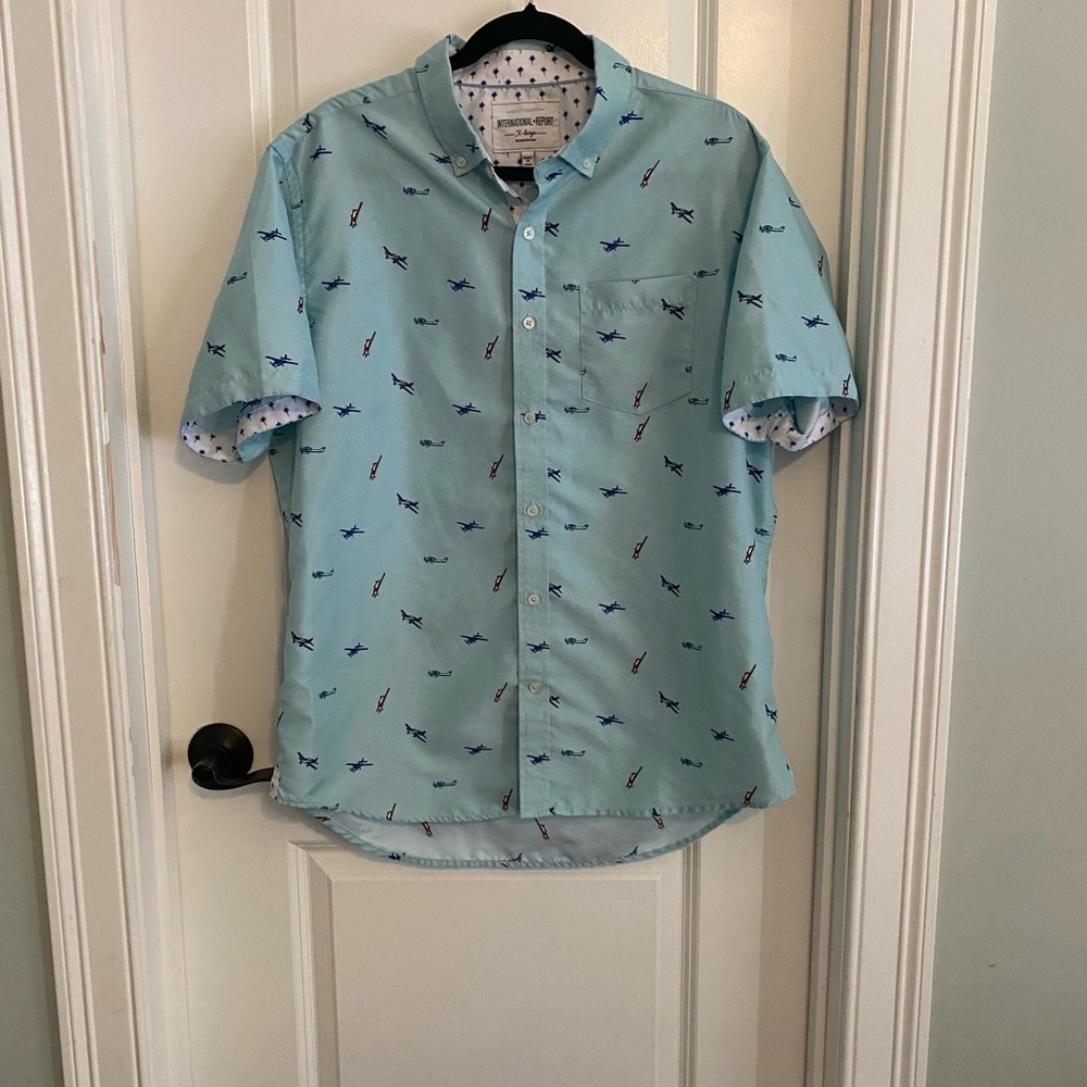 International Report Light Blue Aircraft Short Sleeve Shirt